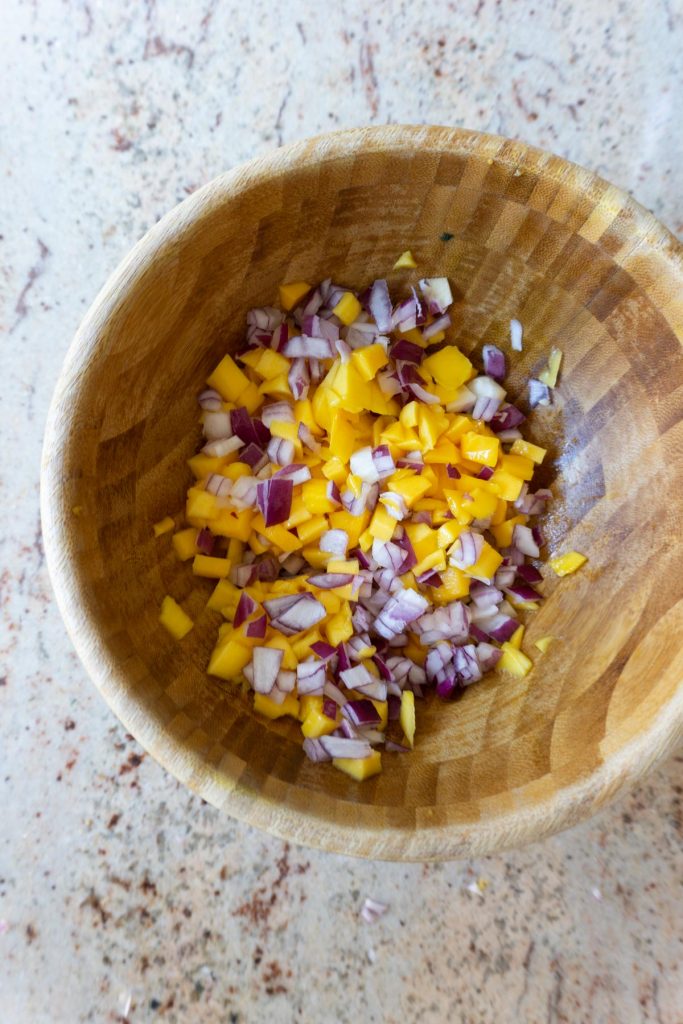 Chopped Mango and finely cut onion in a bowl