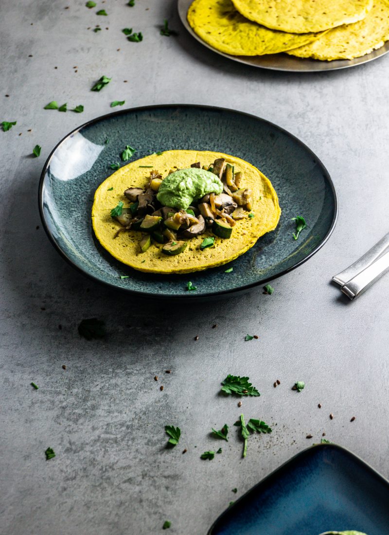 Savory Chickpea Pancakes (for Dinner) on a grey background with plain savory chickpea pancakes in the background