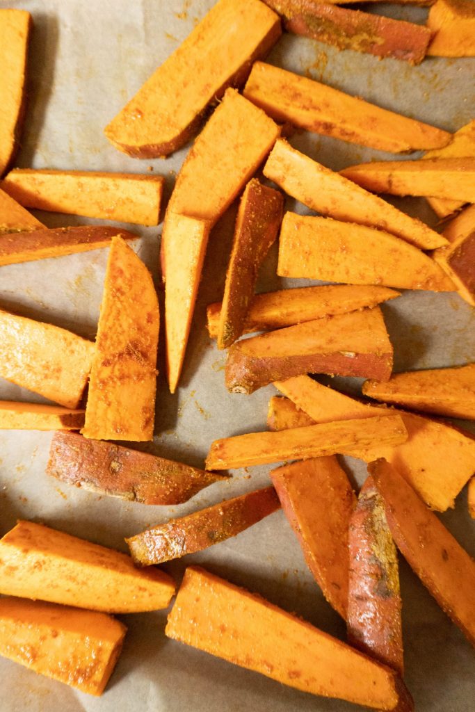 Sweet Potato Wedges on a baking tray before baking