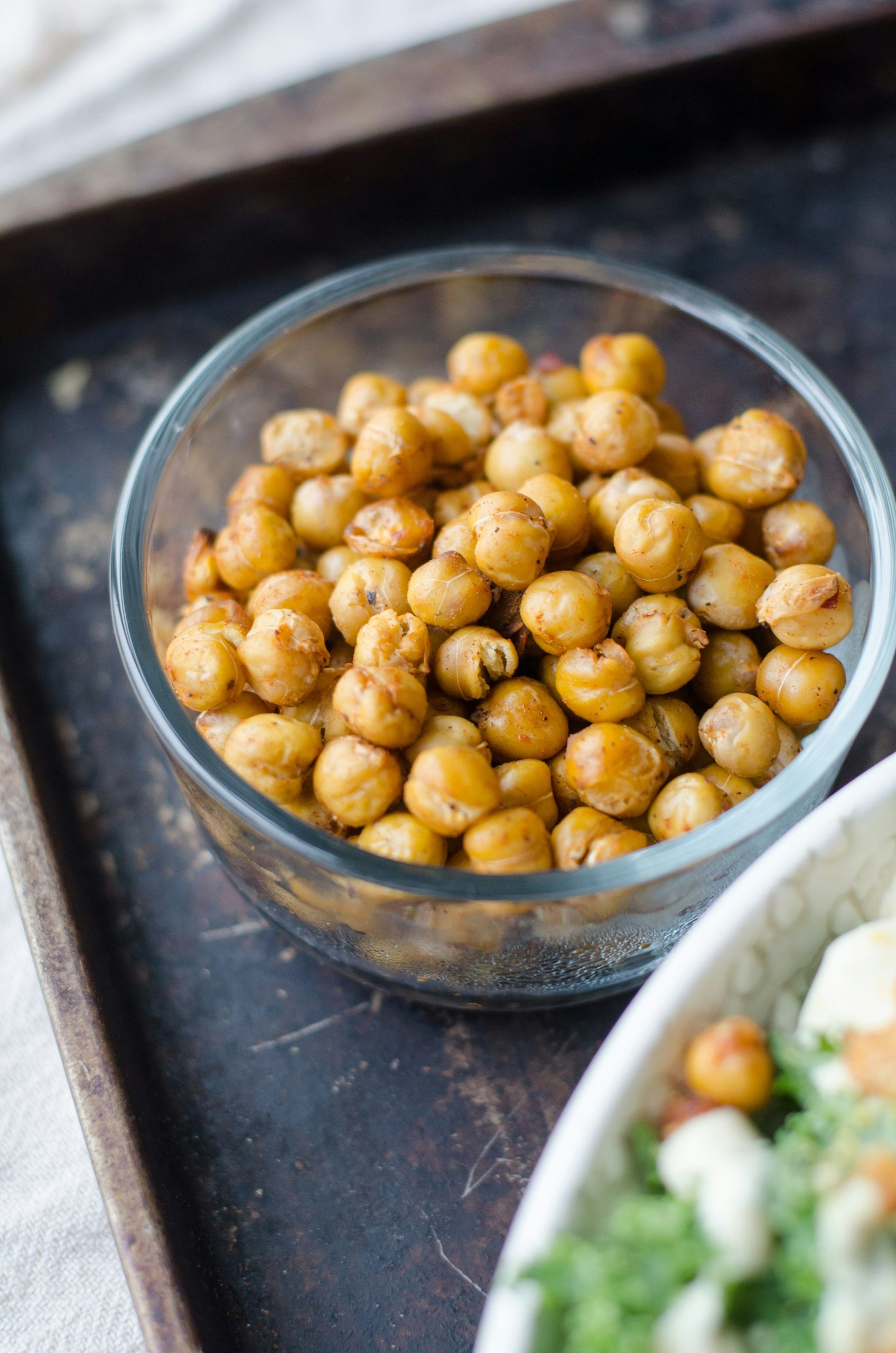A bowl of chickpeas in focus