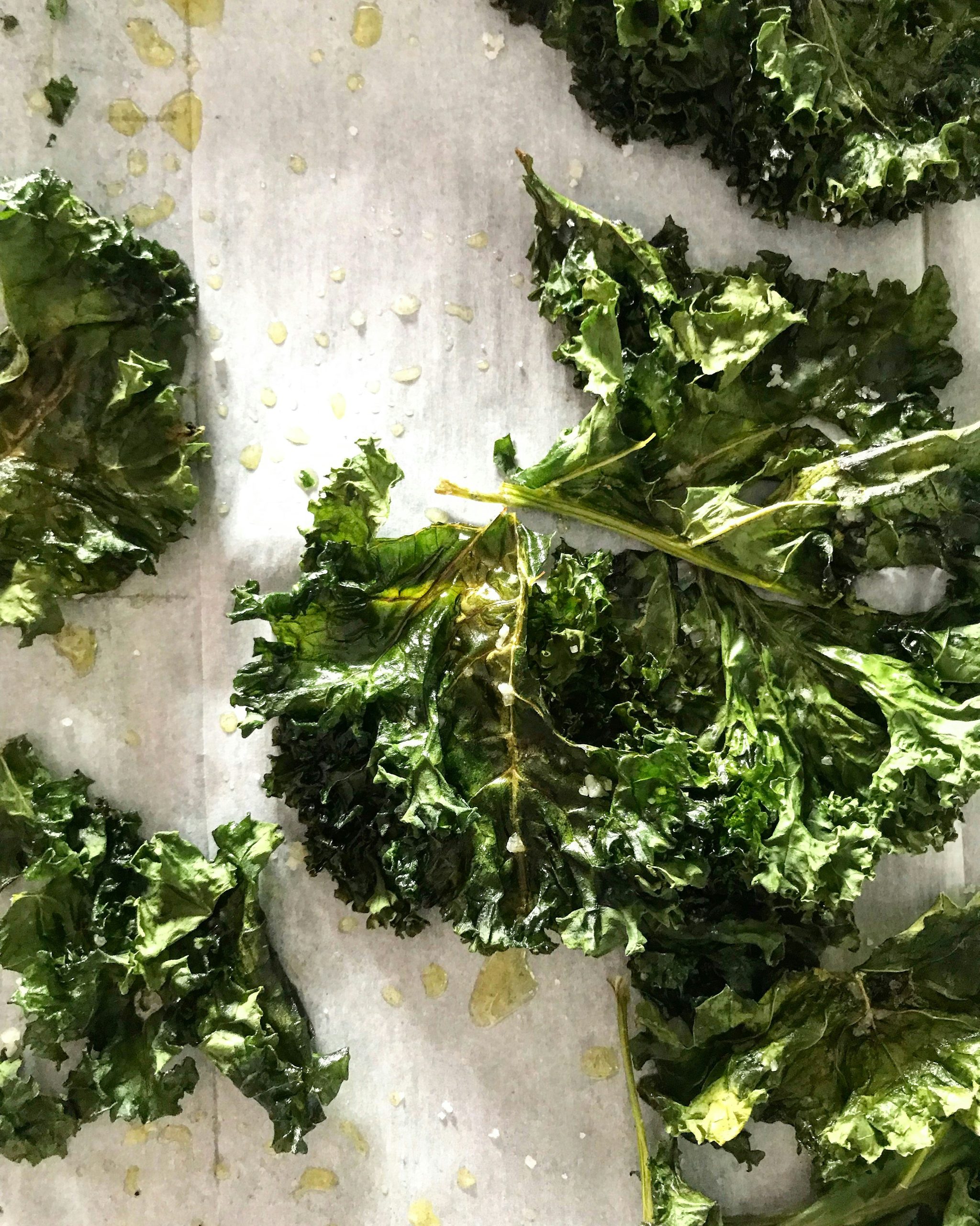 Crispy kale on a wooden background