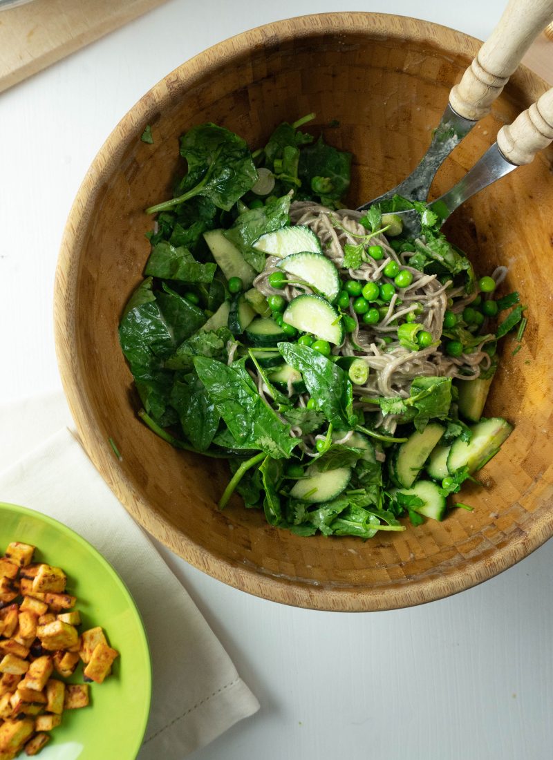 Soba noodles, spinach, cucumber, peas, spring onions, and cilantro are coated in a dressing for this Perfect Soba Noodle Salad