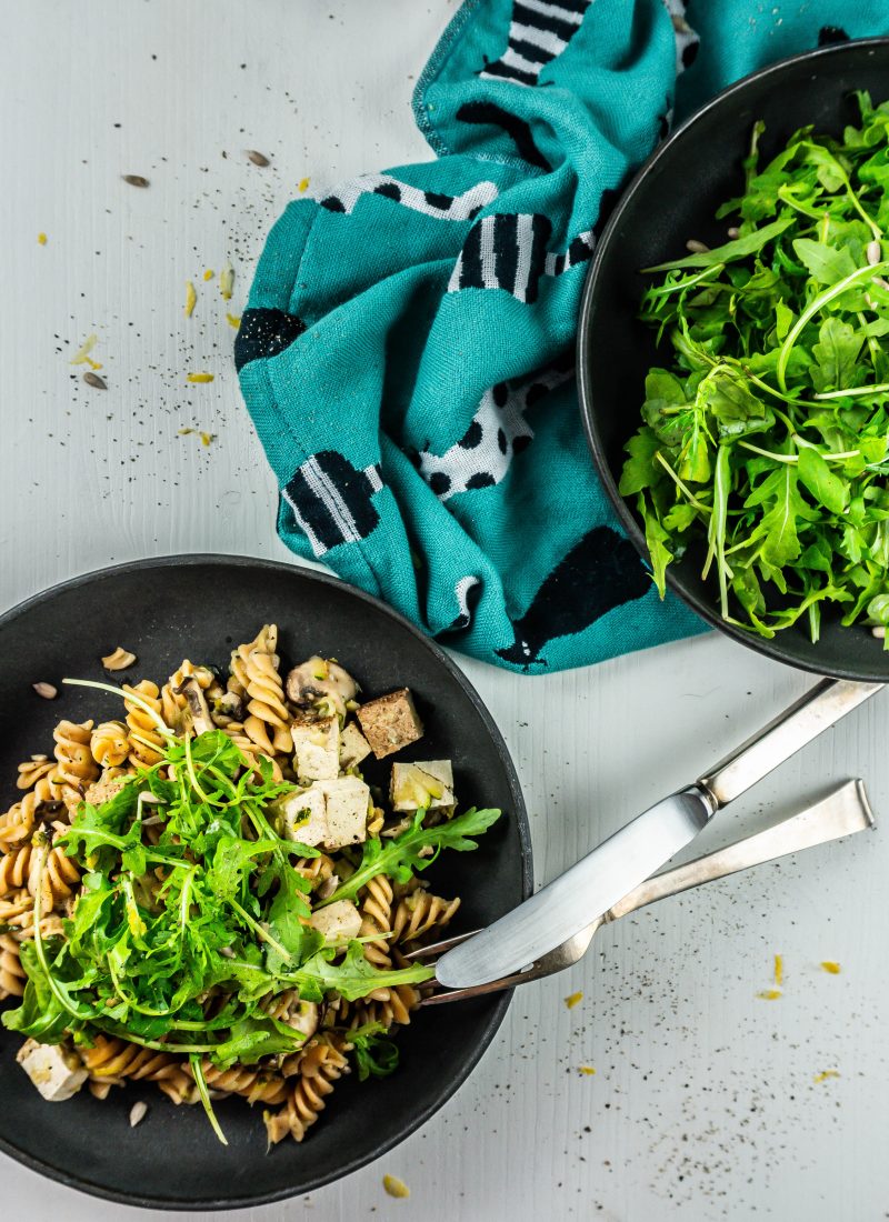 15-Minute Summer Pasta on a plate with a fork and knife resting on the plate; photographed from above
