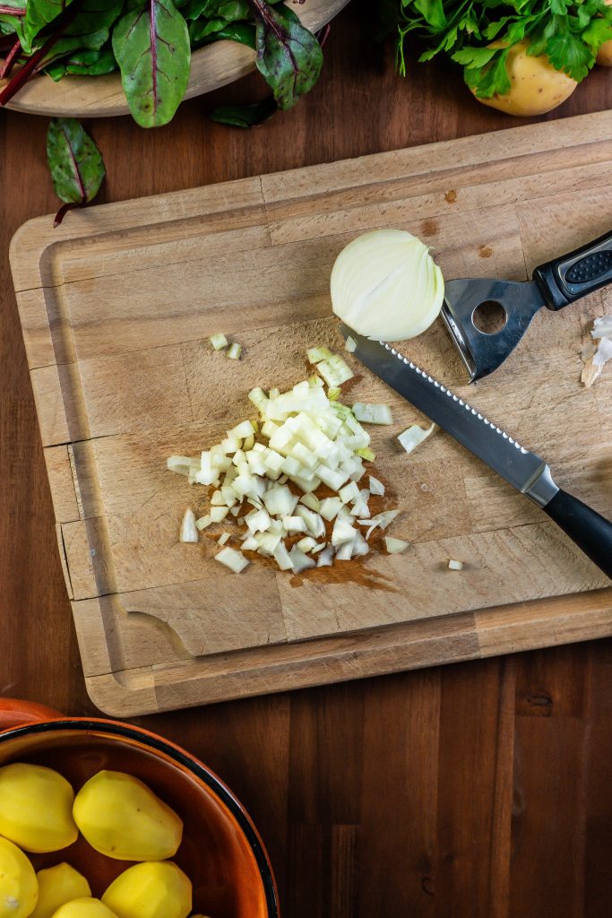 An onion being finely cut; photographed from above