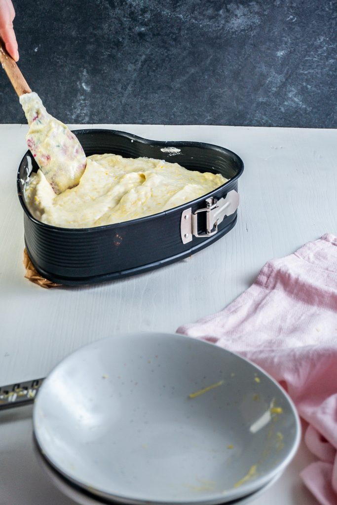 Potato pound cake batter is being put into a form
