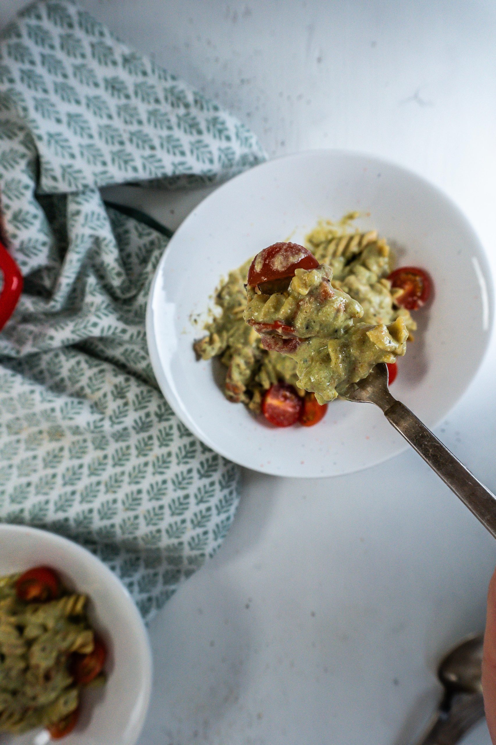 Creamy Avocado Pasta Recipe being highlighted on a fork up close