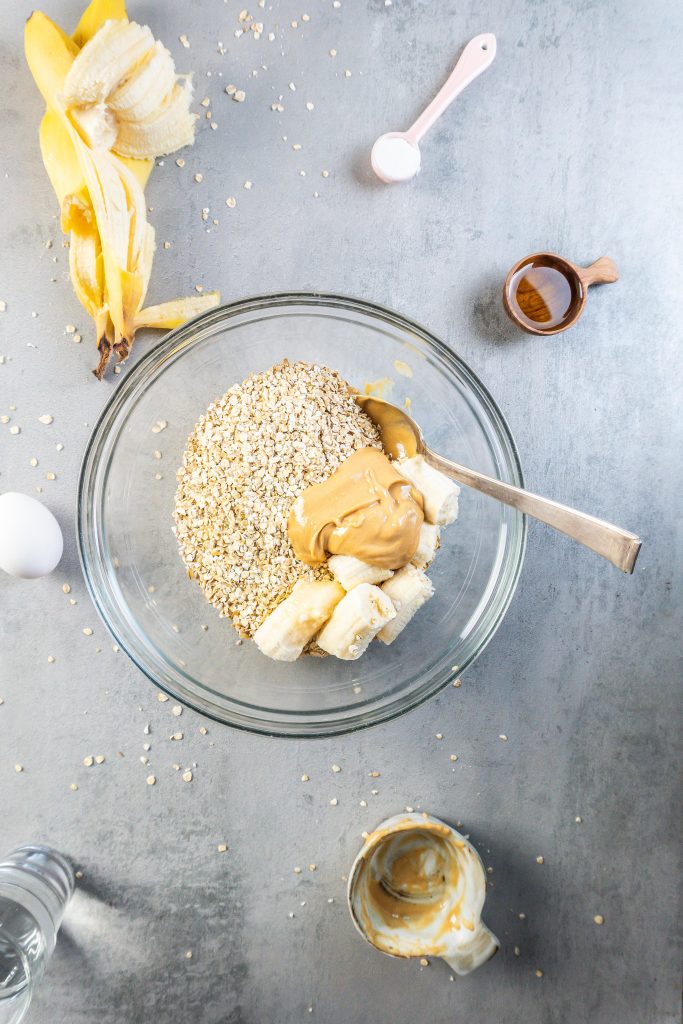 Oats, peanut butter, and banana in a bowl