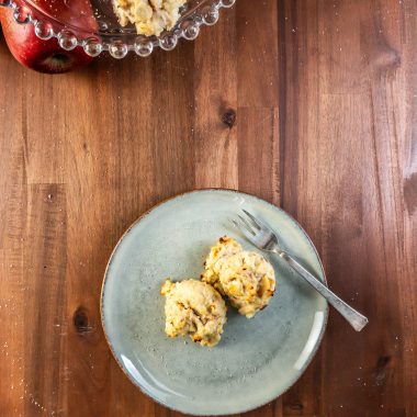 Mini Apple Quark Balls on a plate with some more balls being displayed on a cake stand visible in the background