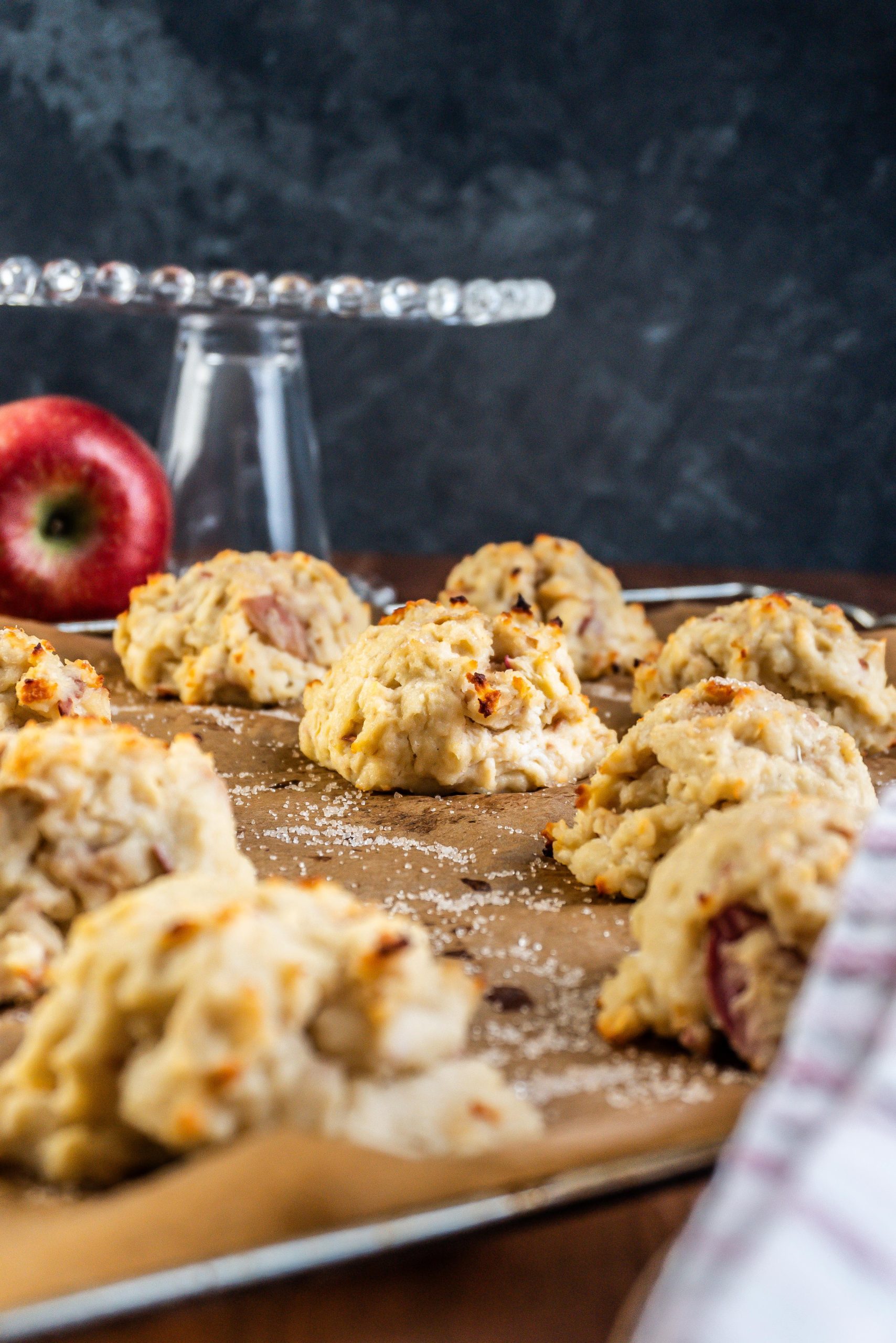 Mini Apple Quark Balls on a baking tray with one specific one in focus