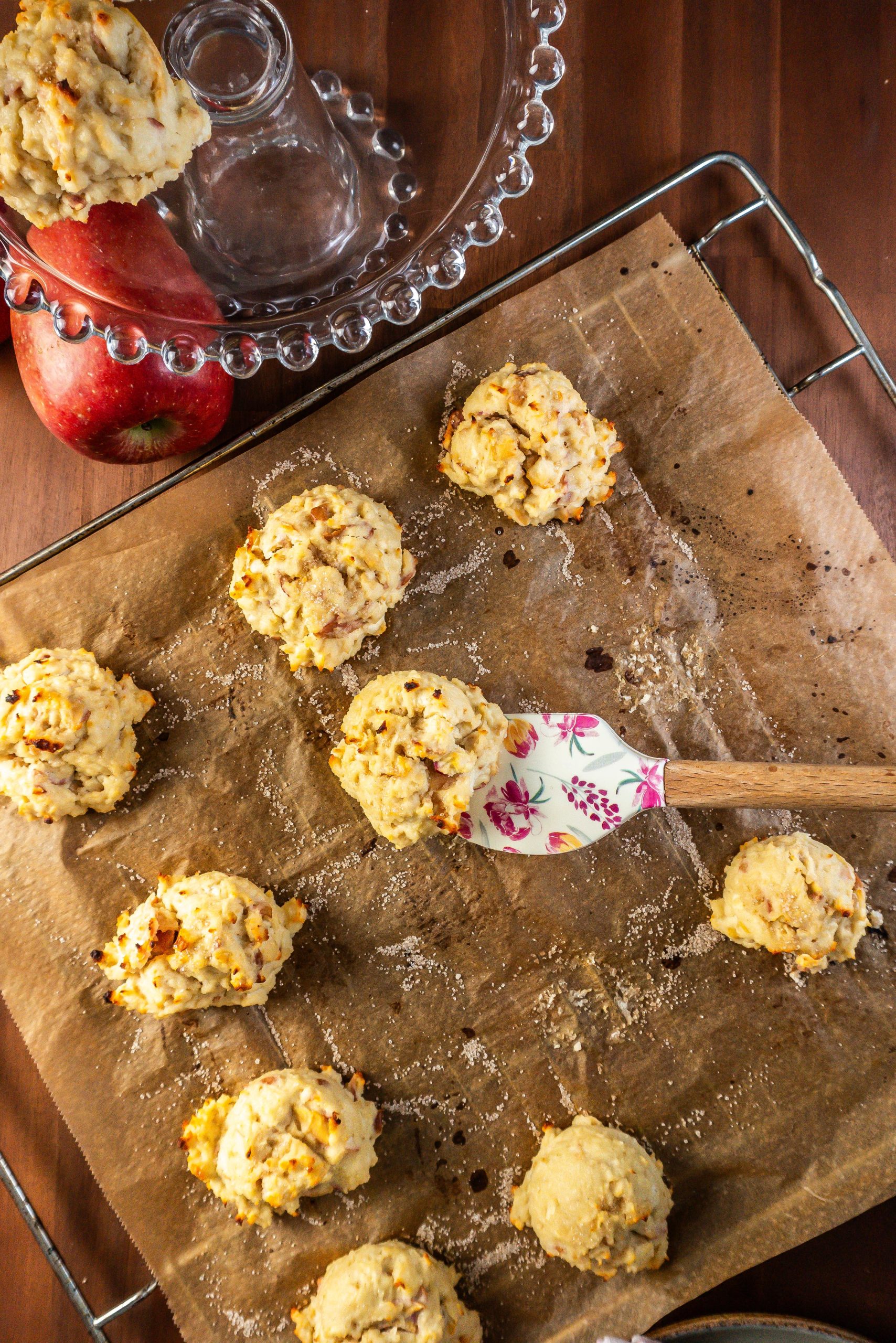 Mini Apple Quark Balls being taken from a baking tray and displayed on a cake stand