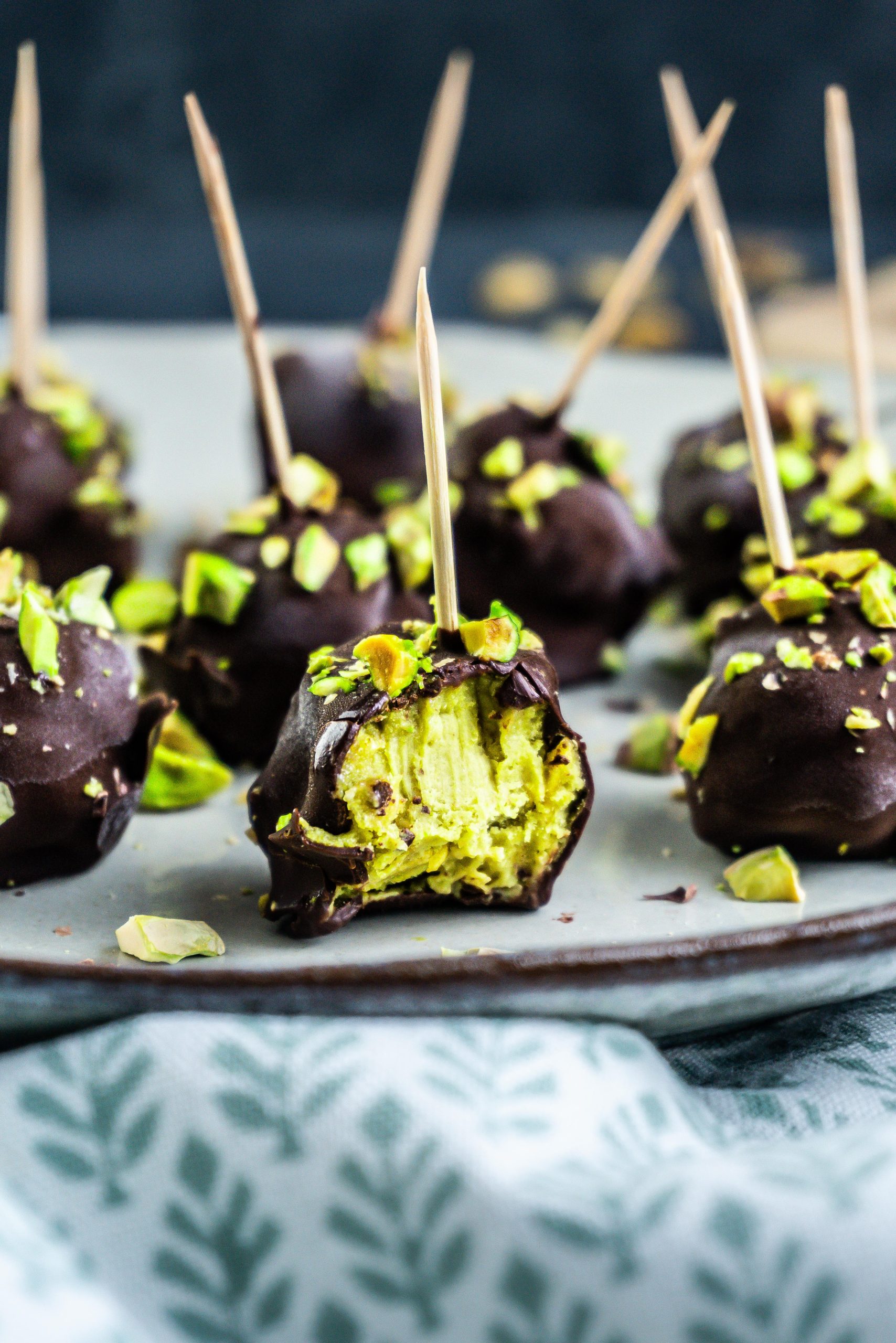 Gluten-free Dubai Style Pistachio Ball bitten into with the pistachio filling visible