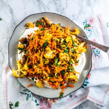 Roasted Cauliflower Salad on a plate with a fork stuck into it