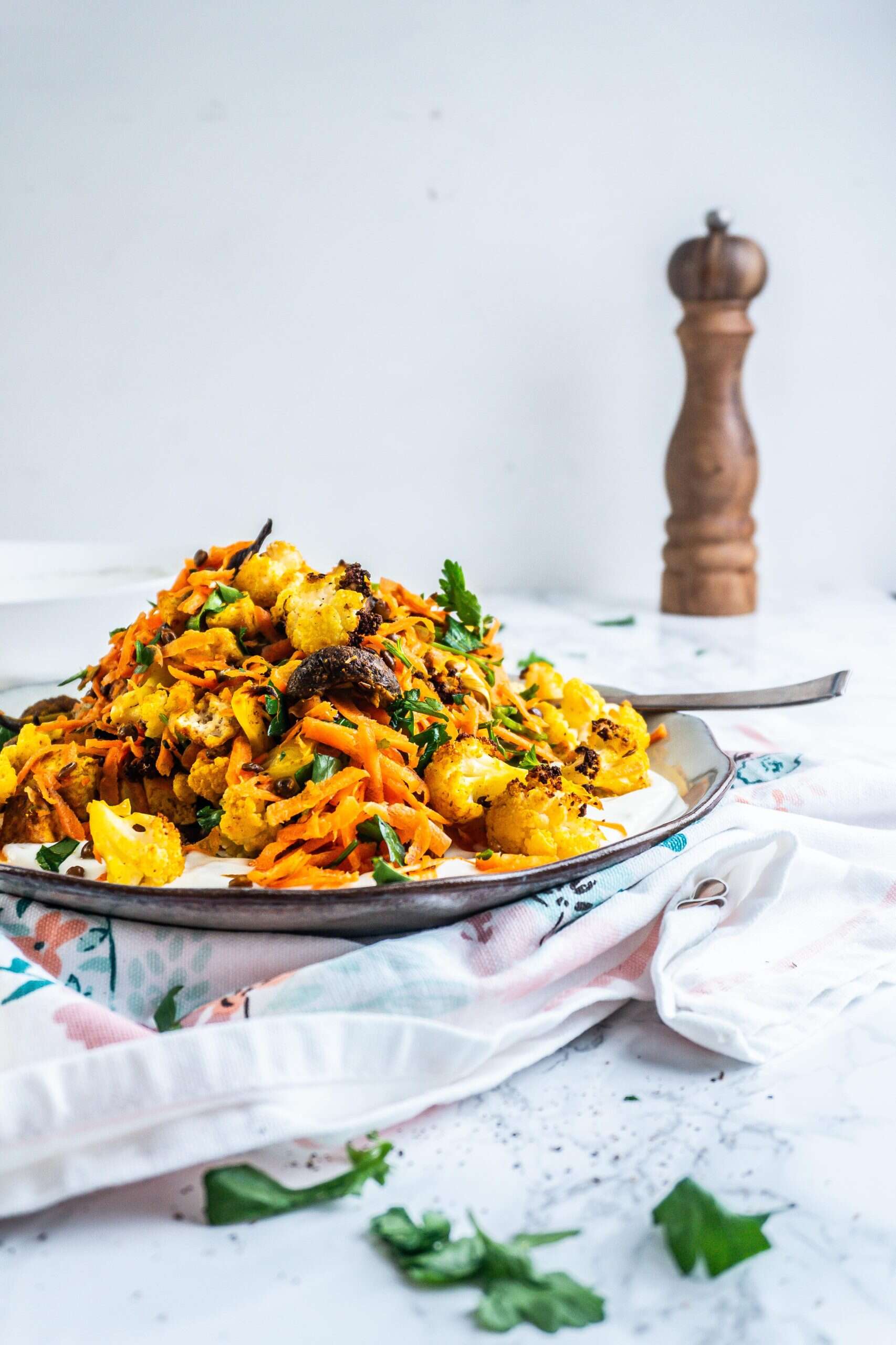 Roasted Cauliflower Salad on a plate with a fork stuck into it