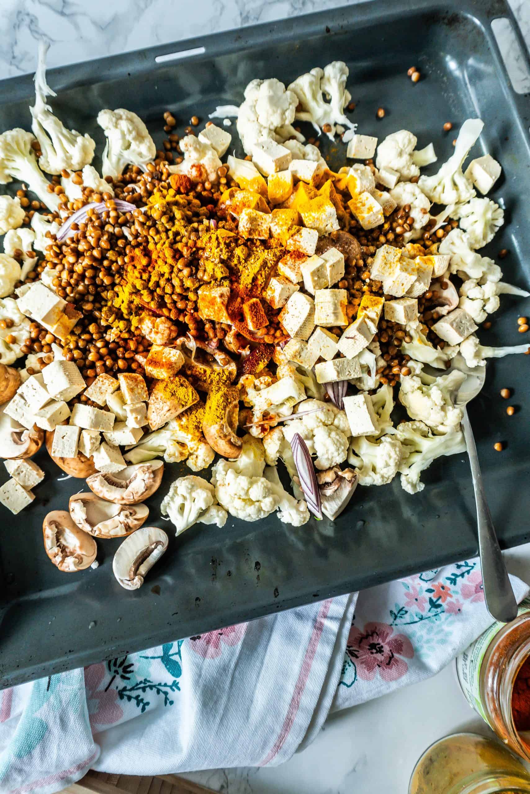 Roasted vegetables on a tray for the Roasted Cauliflower Salad