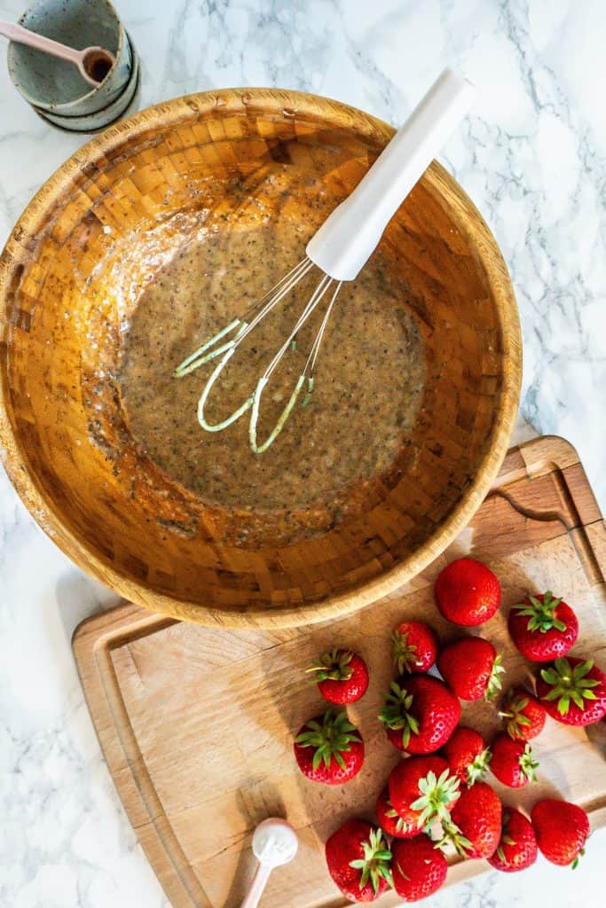 Mixing the liquid ingredients for the Strawberry Banana Muffins in a bowl